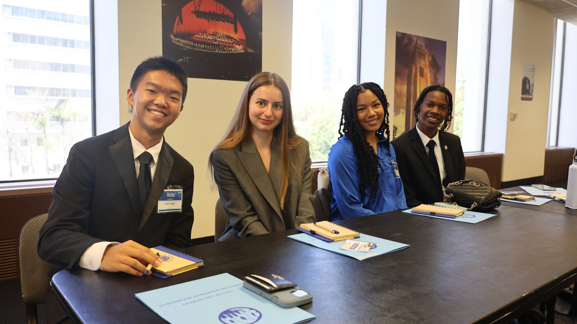 Four OMYC members gathers at a table  